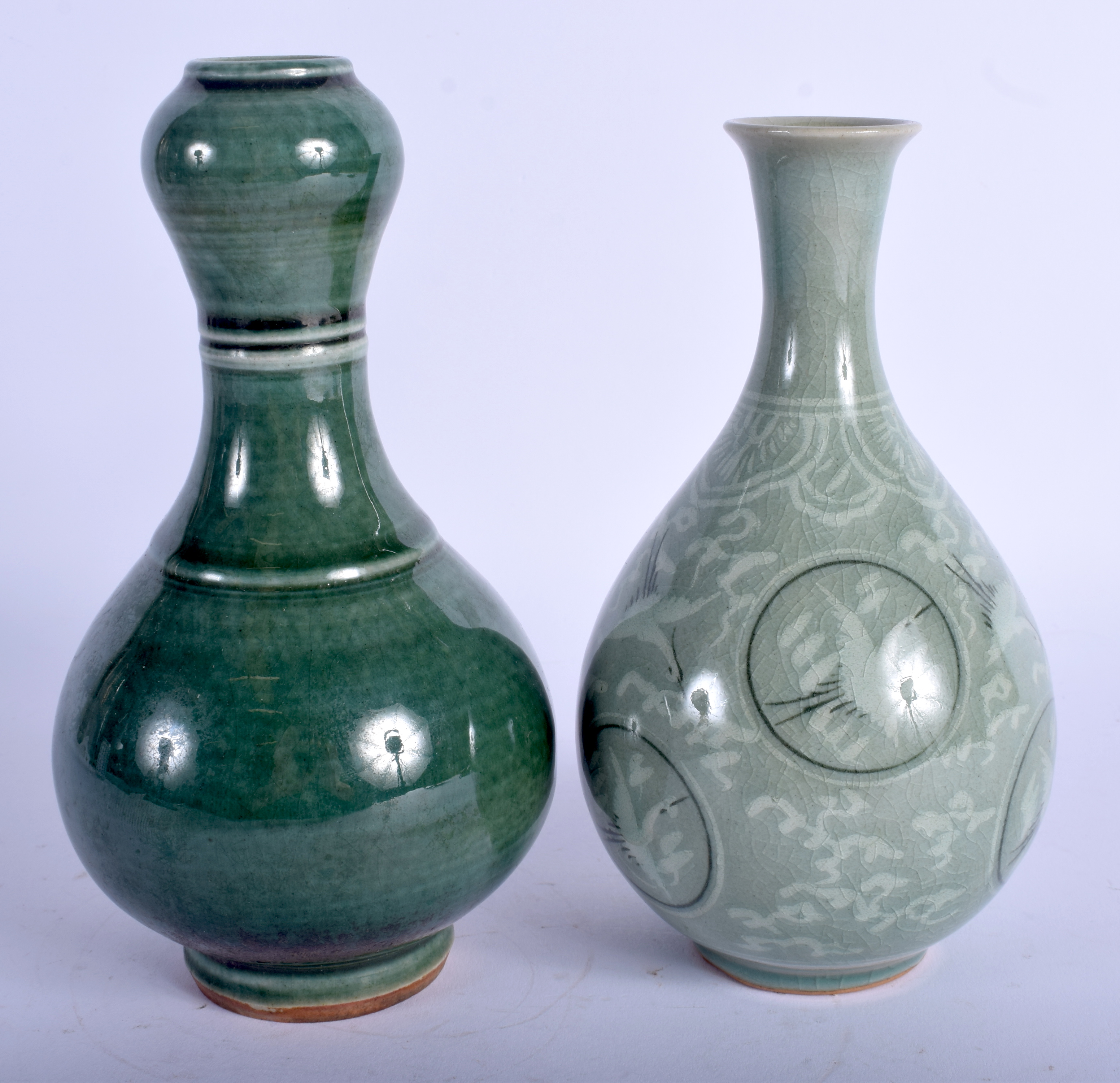 AN EARLY 20TH CENTURY KOREAN STONEWARE VASE together with a garlic neck vase. 18 cm high. (2)