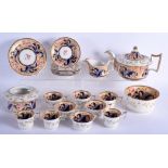 AN EARLY 19TH CENTURY ENGLISH PORCELAIN TEASET possibly Coalport or Spode, painted with roses. Larg