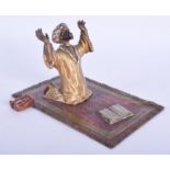 A 19TH CENTURY AUSTRIAN COLD PAINTED BRONZE FIGURE OF AN ARABIC MALE modelled praying upon a rug. 1