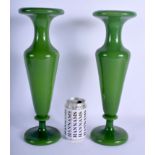 A LARGE PAIR OF EARLY 20TH CENTURY EUROPEAN OLIVE GREEN GLASS VASES of plain form. 38 cm high.