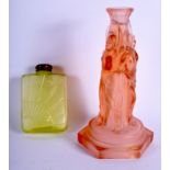 AN ART DECO PEACH GLASS CANDLESTICK together with a similar scent bottle. Largest 25 cm high. (2)