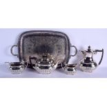 AN ANTIQUE SILVER PLATED TRAY with associated four piece teaset. Tray 50 cm x 36 cm. (5)