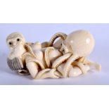 AN EARLY 20TH CENTURY JAPANESE MEIJI PERIOD CARVED IVORY NETSUKE modelled as a pair of squid perfor