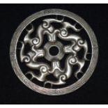 A Chinese white metal plaque 8cm