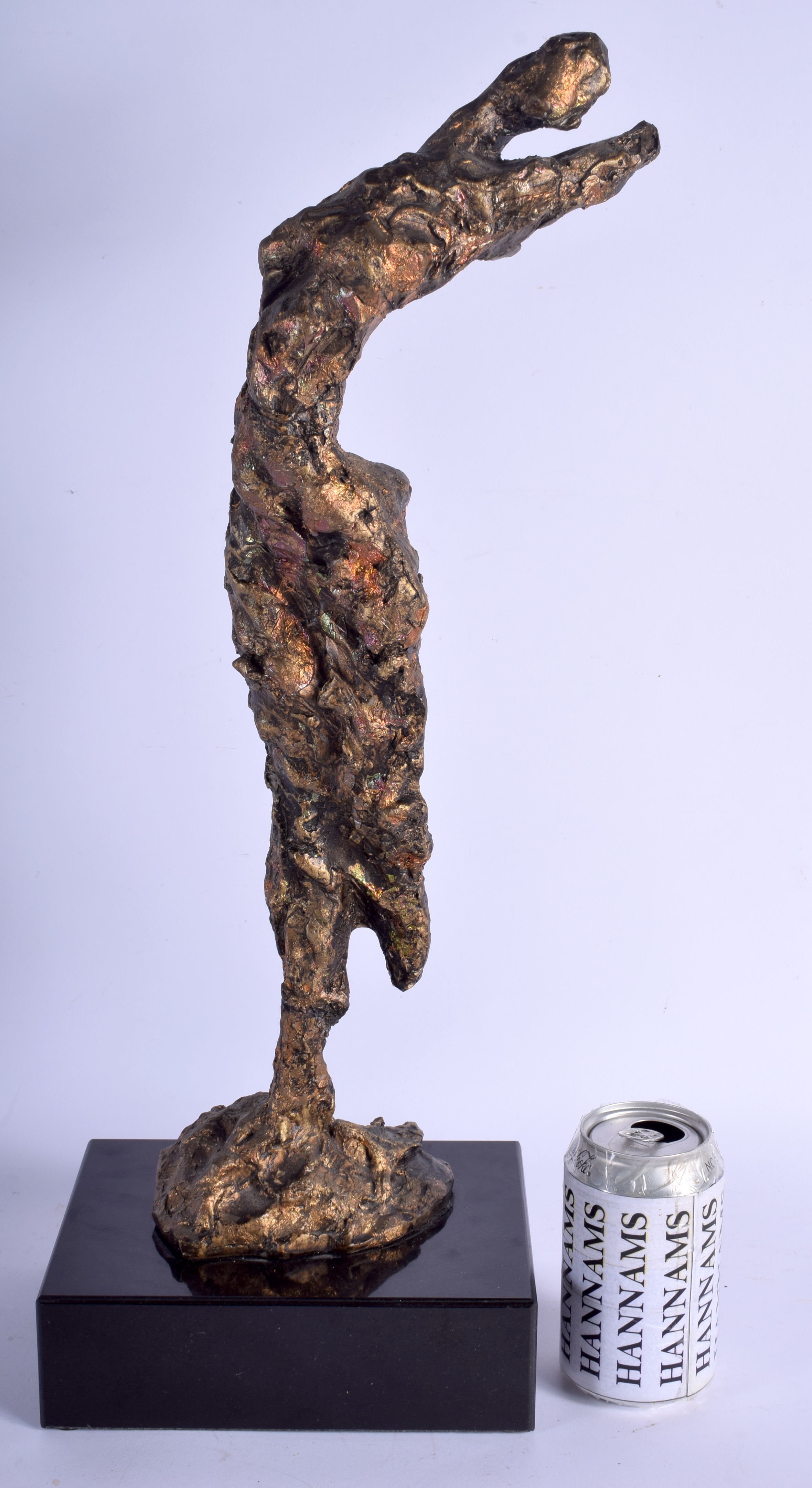 A LARGE ABSTRACT BRONZED FIGURE OF A HUMAN FORM upon a marble base. Figure 48 cm high.