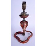 AN EARLY 20TH CENTURY INDIAN PAINTED BRASS FIGURE OF A SERPENT modelled coiled. Snake 21 cm x 14 cm