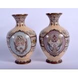 A PAIR OF 19TH CENTURY JAPANESE MEIJI PERIOD CLOISONNE ENAMEL VASES decorated with opposing birds a