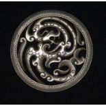 A Chinese white metal dragon plaque 8 cm