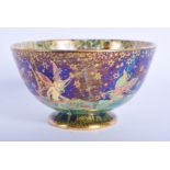 A WEDGWOOD FAIRYLAND LUSTRE BOWL painted with whimsical figures. 9 cm diameter.