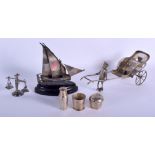 A LARGE CHINESE EXPORT SILVER RICKSHAW together with a silver boat. Largest 19 cm long. (2)