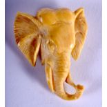 A 19TH CENTURY JAPANESE MEIJI PERIOD CARVED IVORY ELEPHANT BROOCH. 4 cm x 3.5 cm.