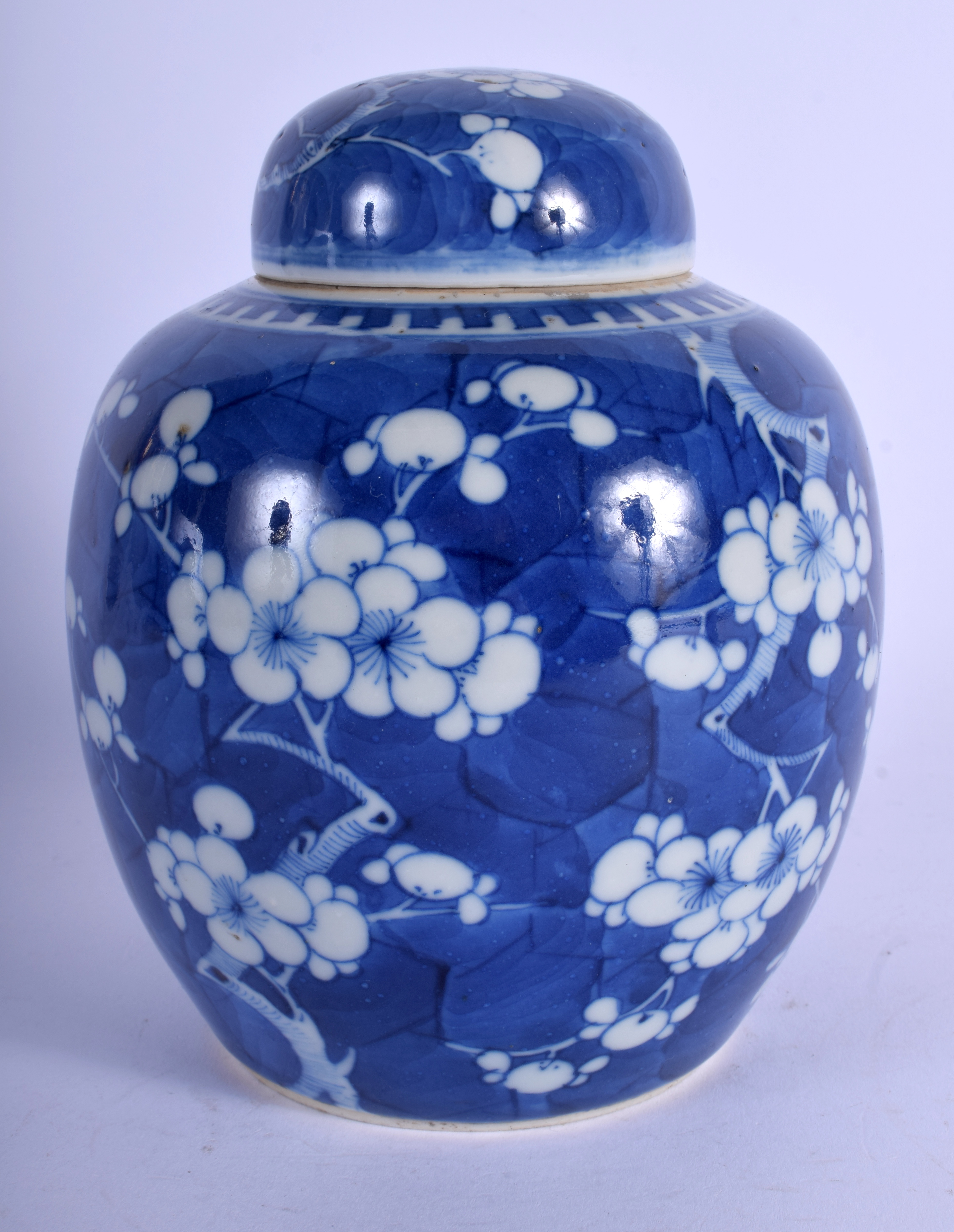 A 19TH CENTURY CHINESE BLUE AND WHITE PORCELAIN GINGER JAR AND COVER bearing Kangxi marks to base.