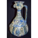 A middle Eastern Pottery Ewer. 37cm high