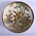 A 19TH CENTURY JAPANESE MEIJI PERIOD SATSUMA DISH painted with birds within landscapes. 20 cm diame