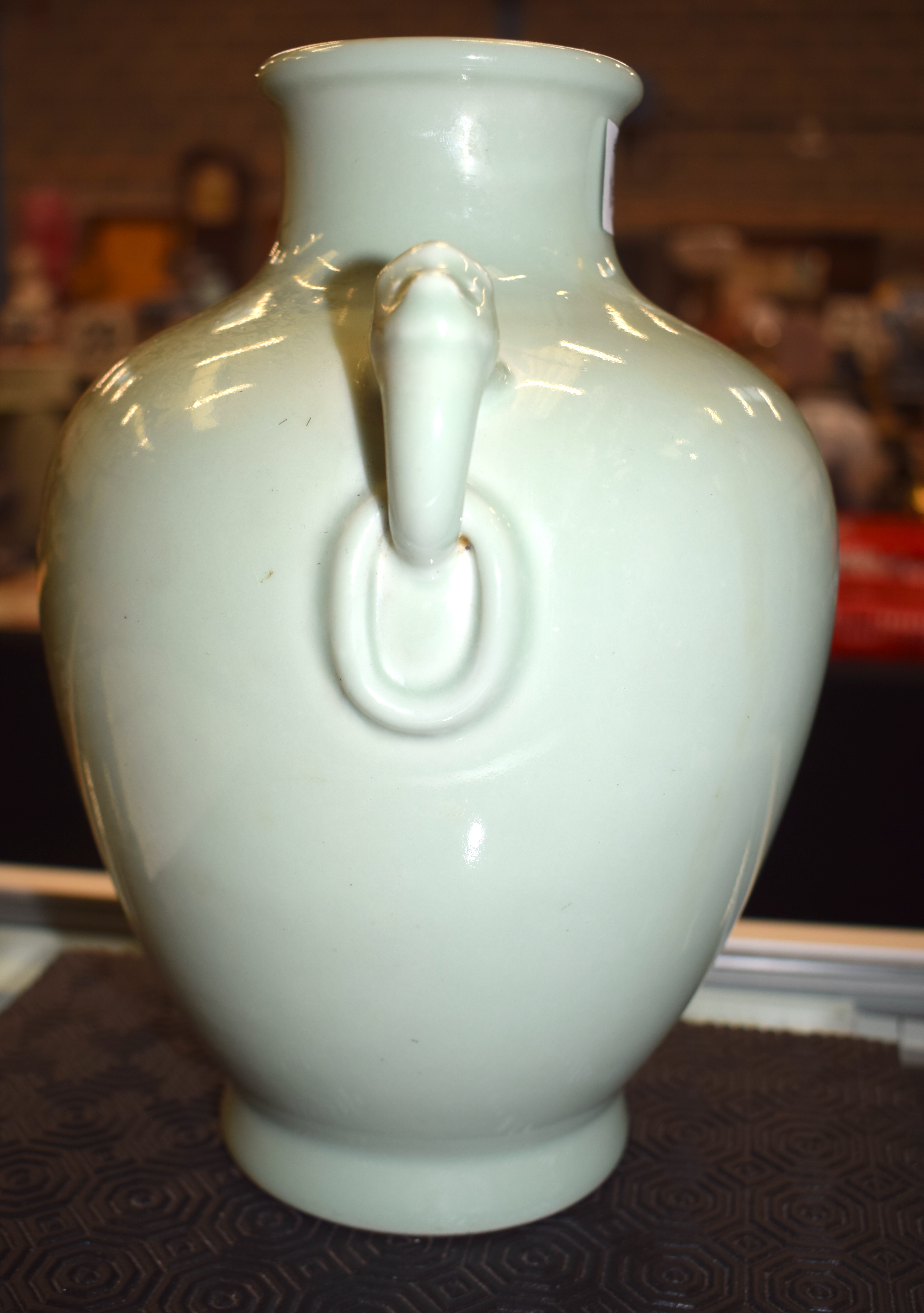 A CHINESE CELADON TWIN HANDLED PORCELAIN VASE bearing Qianlong marks to base. 24 cm x 14 cm. - Image 8 of 12