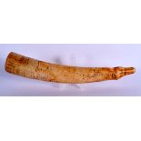 AN 18TH/19TH CENTURY AFRICAN CARVED IVORY TRIBAL OLIPHANT of naturalistic form. 39 cm long.