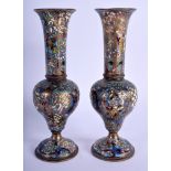 A PAIR OF 19TH CENTURY FRENCH BRONZE CHAMPLEVE ENAMEL VASES decorated with foliage and vines. 19 cm