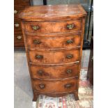 A 5 Drawer Chest of Drawers walnut veneered. 114cm x 61cm