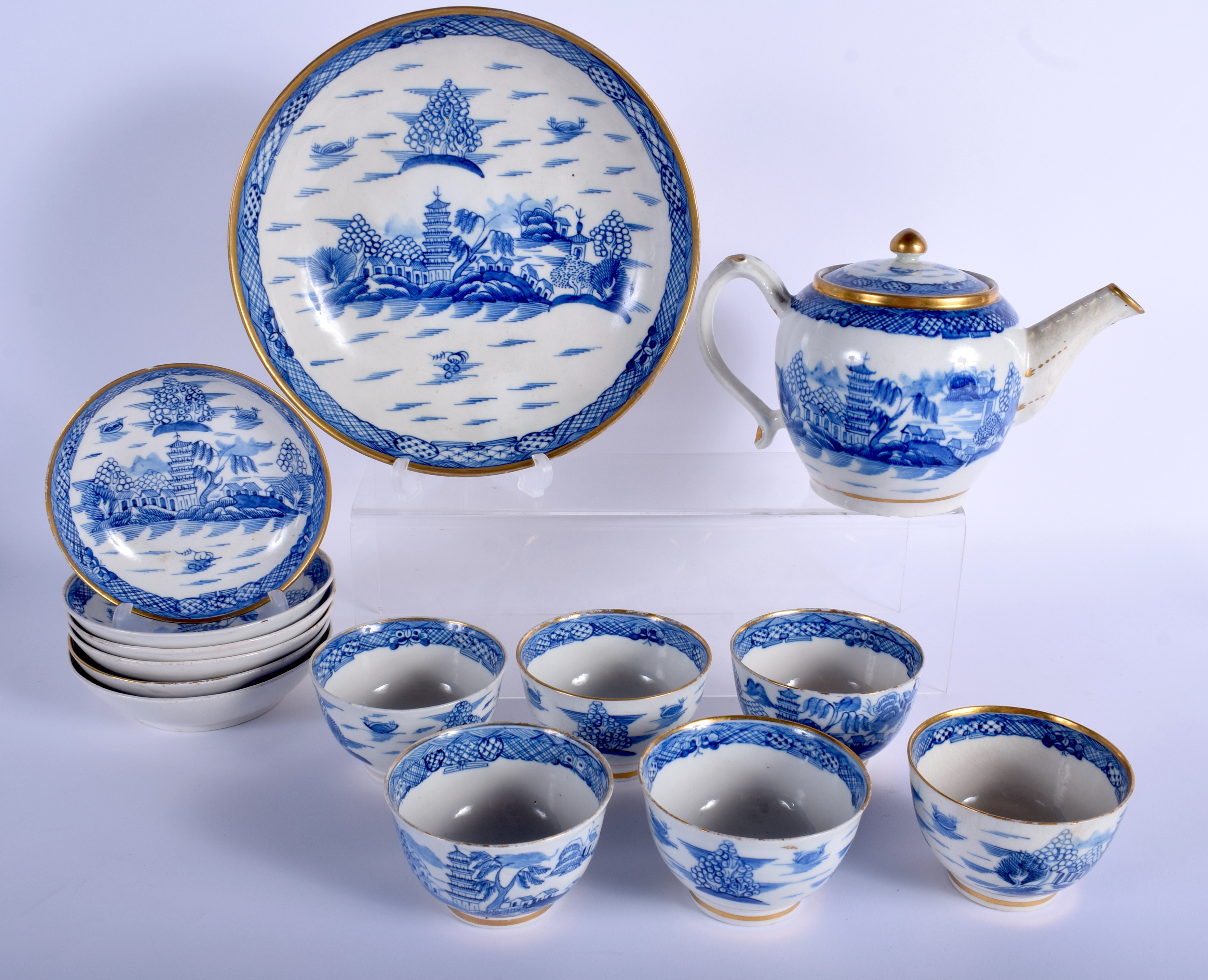 AN EARLY 19TH CENTURY ENGLISH PEARLWARE TEASET painted with landscapes. Largest 24 cm wide. (14)