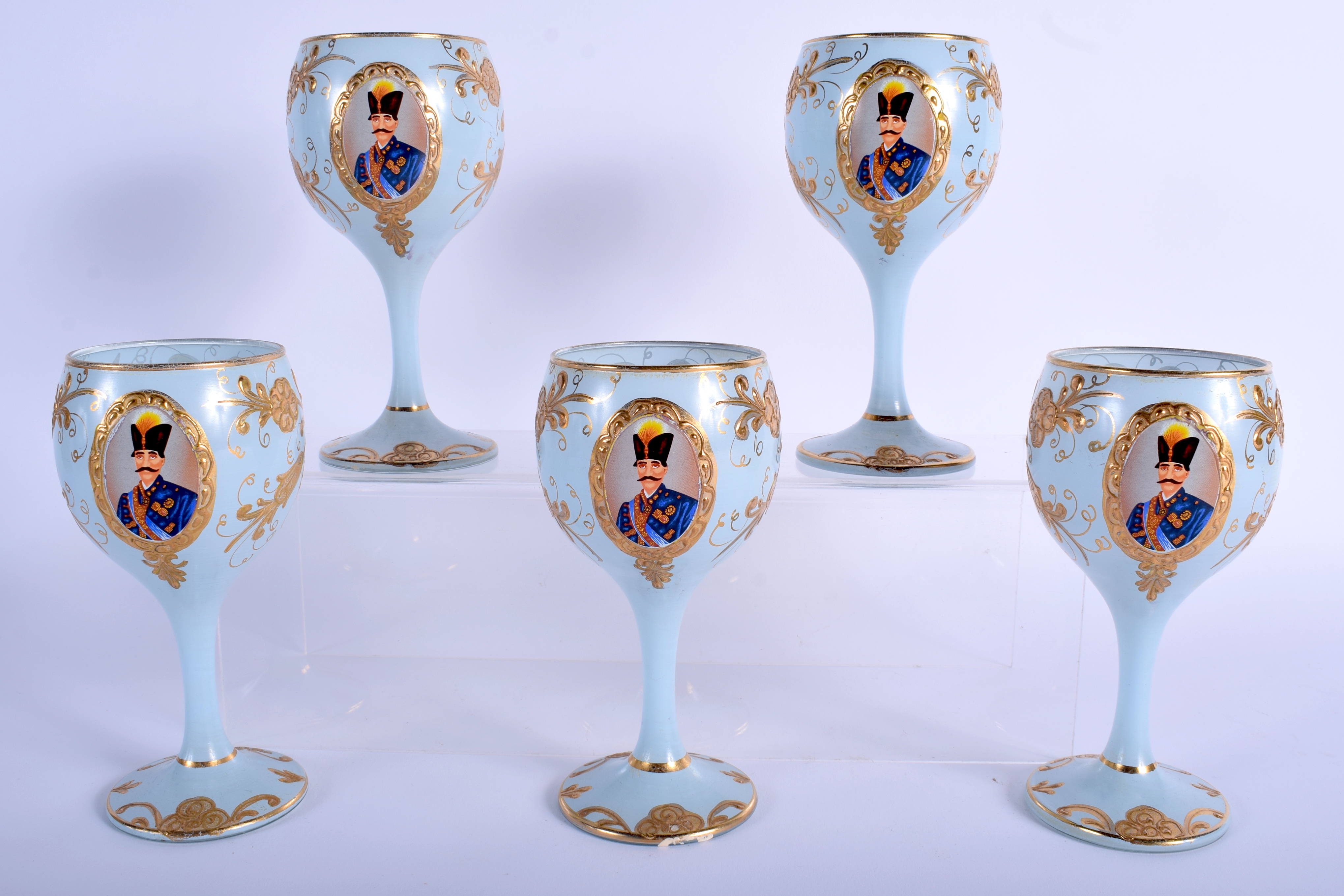 FIVE UNUSUAL VINTAGE MIDDLE EASTERN BLUE GOBLETS decorated with portraits. 14.5 cm high.