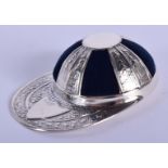 A SILVER JOCKEY HAT PIN CUSHION. 4.75 cm wide.