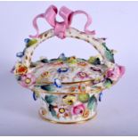 Early 19th c. pot pourri basket and cover encrusted with flowers the handle entwined with ribbons