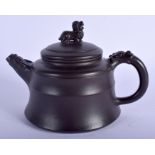 A CHINESE YIXING POTTERY TEAPOT AND COVER 20th Century, with Buddhistic lion terminal. 16 cm wide.