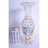 A FINE 19TH CENTURY BOHEMIAN ENAMELLED CLEAR GLASS VASE painted with flowers and trailing vines. 27