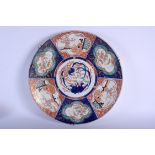 A LARGE 19TH CENTURY JAPANESE MEIJI PERIOD IMARI CHARGER painted with figures and birds. 44 cm diam
