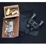 A quantity of fishing lures and a set of wave line binoculars