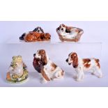 FOUR ROYAL DOULTON DOGS together with a Beswick toad. (5)