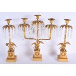 A LARGE 19TH CENTURY FRENCH BRONZE CRYSTAL LUSTRE GARNITURE formed with birds. 49 cm x 35 cm. (3)