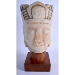 A LARGE CHINESE CARVED MARBLE BUST OF A BUDDHISTIC DEITY Ming/Qing, modelled wearing a headdress. M