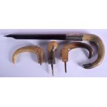 A 19TH CENTURY CONTINENTAL CARVED RHINOCEROS HORN HANDLE together with three other horn handles. La