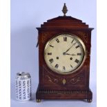 A LOVELY REGENCY BRASS INLAID MANTEL CLOCK Stollenwerck of Paris, the case decorated with scrolling