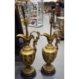 A LARGE PAIR OF 19TH CENTURY CONTINENTAL BRONZE URNS converted to lamps. 60 cm high not inc fitting