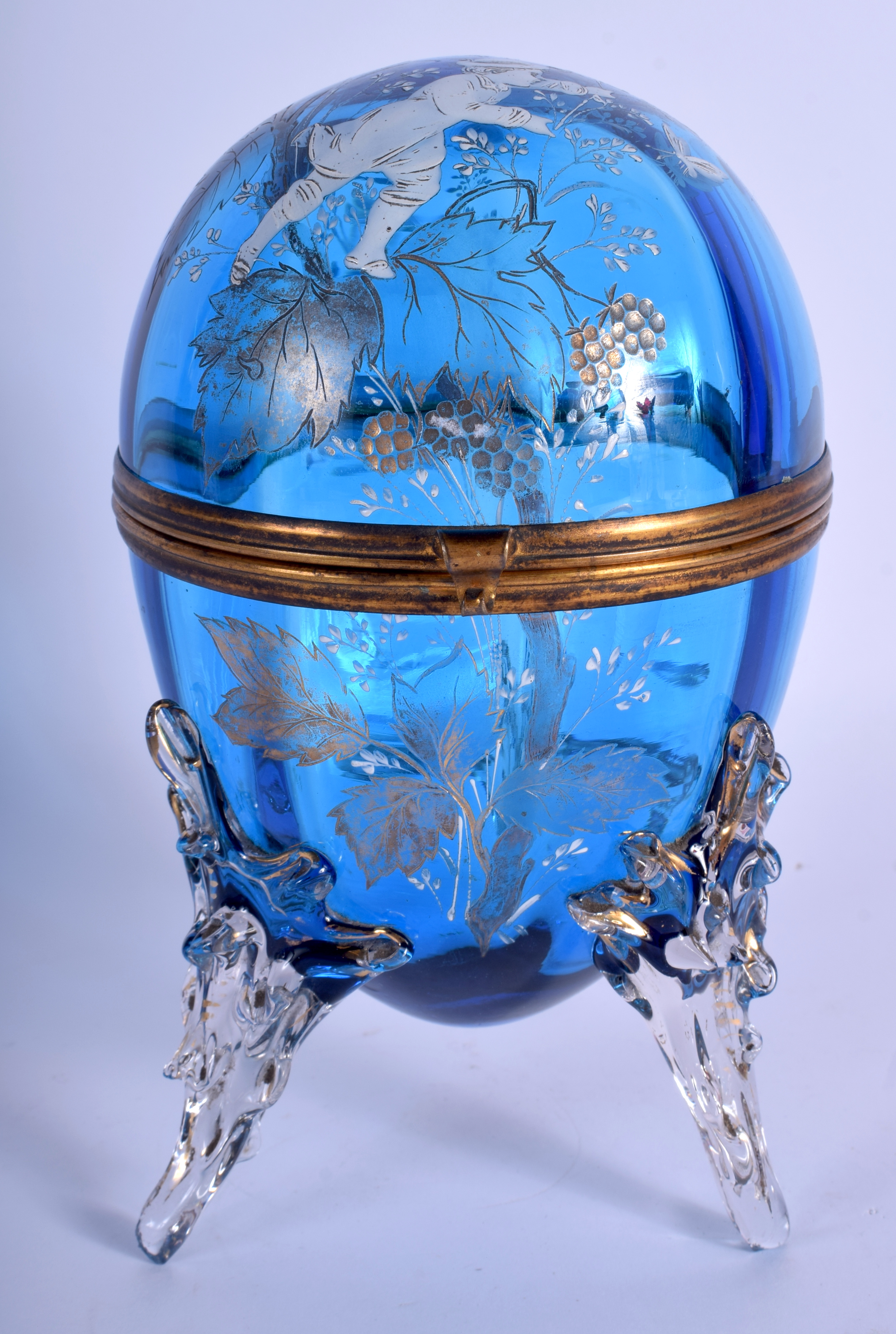 A VICTORIAN EGG SHAPED BLUE GLASS BOX AND COVER enamelled with Mary Gregory. 21 cm high.