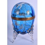 A VICTORIAN EGG SHAPED BLUE GLASS BOX AND COVER enamelled with Mary Gregory. 21 cm high.