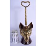 A 19TH CENTURY BRONZE HUNTING FOX AND STIRRUP DOOR STOP. 38 cm high.