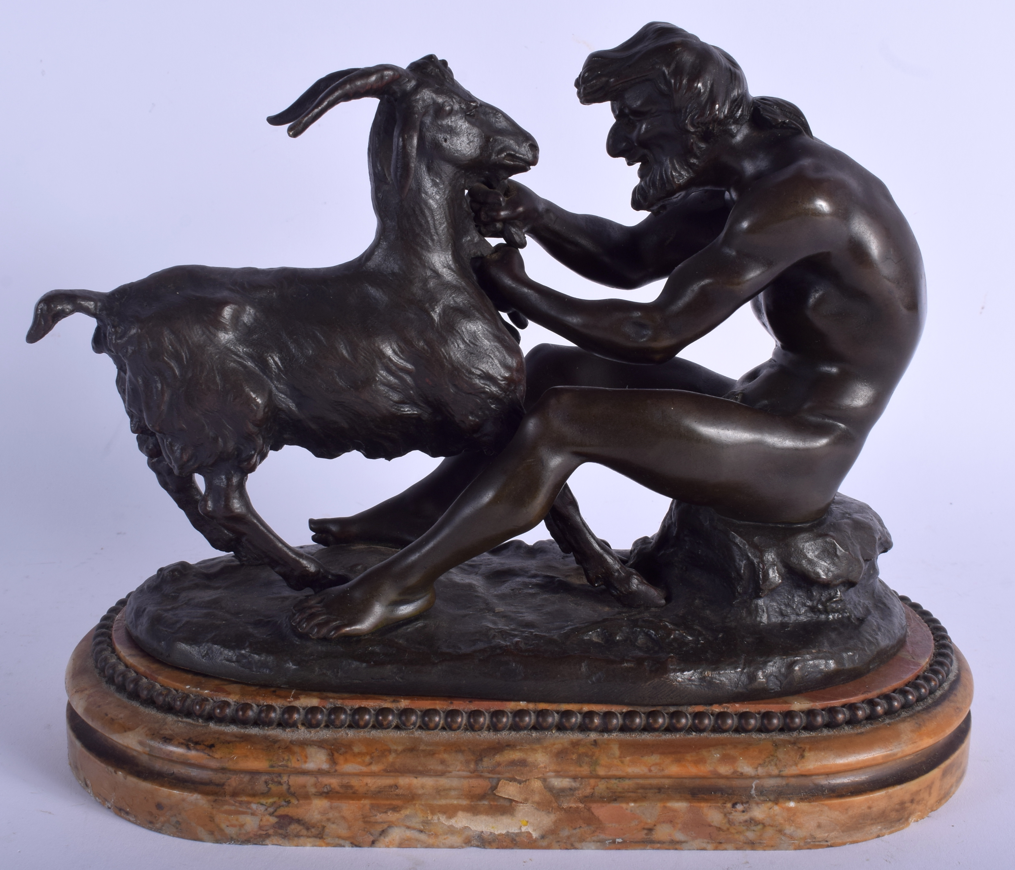 A 19TH CENTURY EUROPEAN BRONZE FIGURE OF PAN AND A GOAT modelled upon a sienna marble base. 24 cm x
