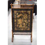A 19TH CENTURY CHINESE FRAMED BLACK SILKWORK PANEL within a lovely aesthetic movement bamboo frame.