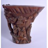A CHINESE CARVED BUFFALO HORN TYPE LIBATION CUP. 14 cm x 12 cm.