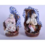 A PAIR OF 19TH CENTURY CONTINENTAL PORCELAIN FIGURES modelled as a male and female within chairs. 1