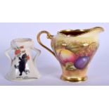 AN AYNSLEY FRUIT PAINTED CREAM JUG together with a crested ware black cat vase. Largest 10 cm wide.