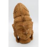 A stone Buddhas head 15 cm