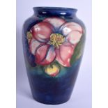 A WILLIAM MOORCROFT VASE painted with foliage. 16 cm high.