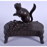 A 19TH CENTURY JAPANESE MEIJI PERIOD BRONZE OKIMONO OF A RAT modelled upon a shaped base. 13 cm x 1