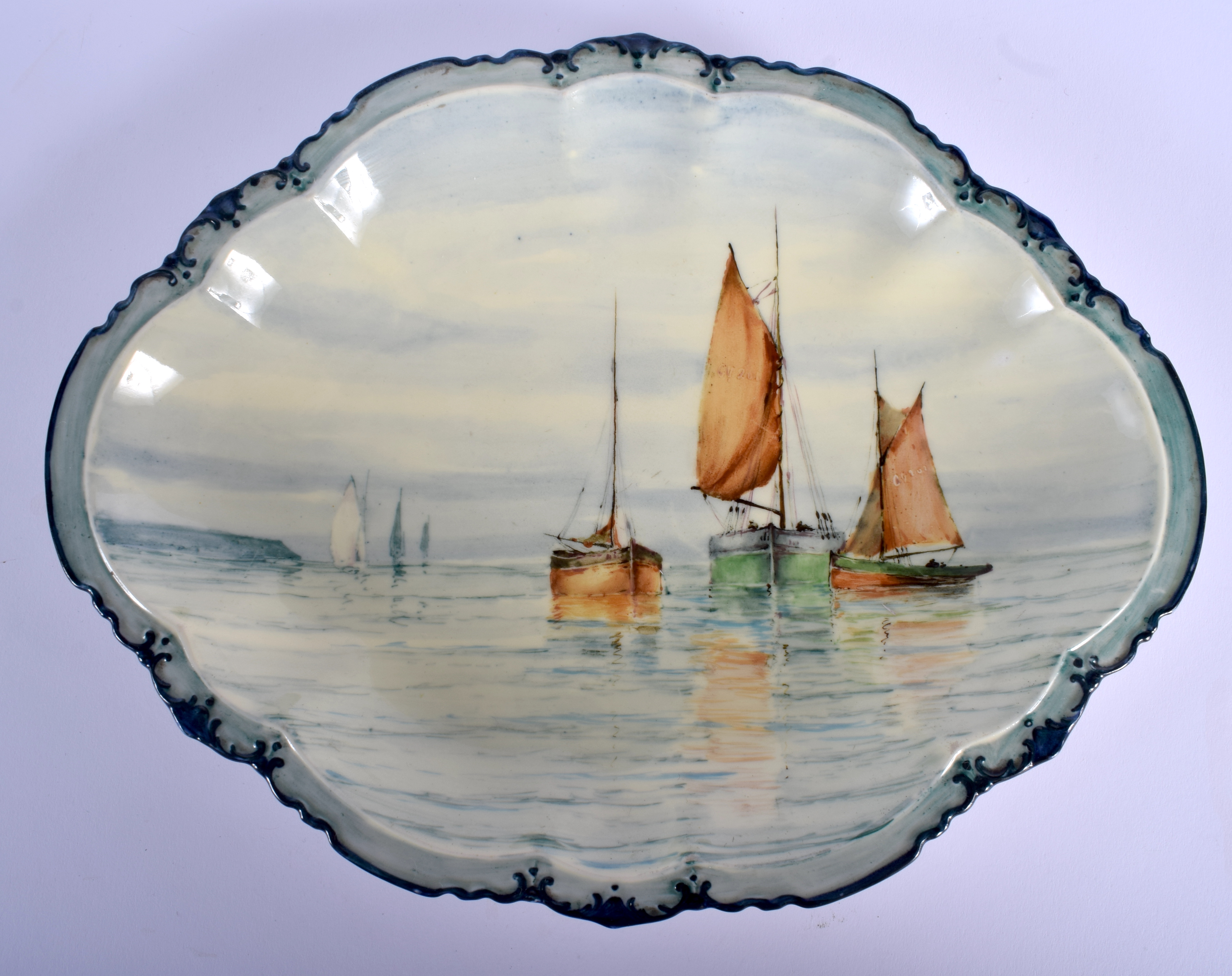 A RARE ROYAL CROWN DERBY PORCELAIN OVAL DISH probably by W E J Dean, painted with sailing boats. 26