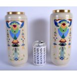 A LARGE PAIR OF ART DECO FRENCH SARREGUEMINES VASES enamelled with motifs. 27 cm high.