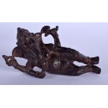 A 19TH CENTURY INDIAN BRONZE FIGURE OF A RECLINING GANESHA modelled in foliate robes. 15 cm x 10 cm